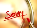 sorry word written by red lipstick